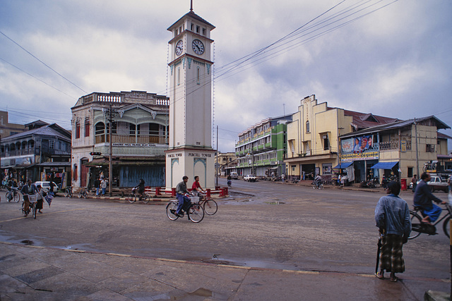 Pyinoolwin Clock Tower, Maymyo, 1996. Street seen is entirely different today. No bicycles anymore Now just motorcycle and motor vehicle congestion. AWP 0383