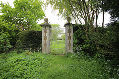 Suffolk. Saxham Hall. Entrance to c1900 formal garden between house and lake