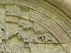 rochester cathedral, kent (104)hand of god detail and lettering "aries per cornua" from the sacrifice of isaac on the early to mid c12 tympanum of the day stair to the dormitory, in the east walk of the cloister