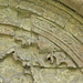 rochester cathedral, kent (104)hand of god detail and lettering "aries per cornua" from the sacrifice of isaac on the early to mid c12 tympanum of the day stair to the dormitory, in the east walk of the cloister