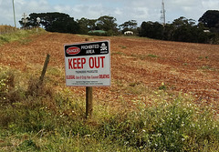 opium poppy farm warning sign