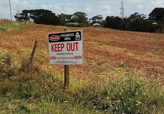 opium poppy farm warning sign