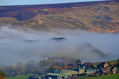 Shire Hill peeping through the mist