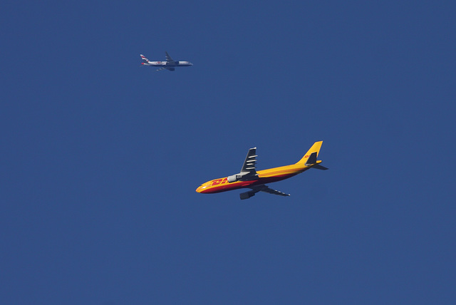 DHL Airbus A300, with a British Airways Boeing 777- 200 in the airspace behind