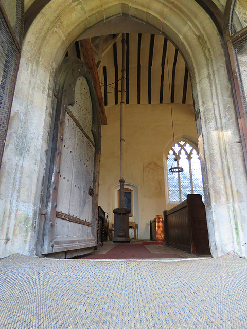 belchamp walter church, essex,c14 south doorway of nave, opening onto a tortoise stove