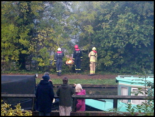 firefighters at a boat fire