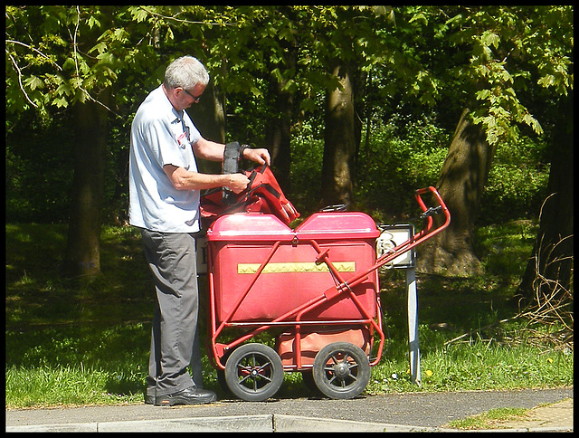 postman with pouch and trolley