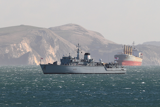 HUNT-class mine countermeasures vessel, HMS Hurworth (M39), anchored near cargo ship Star Hyperion (IMO: 9145956) in Weymouth Bay