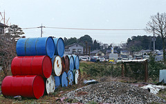 Drums and abandoned vehicles