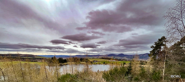Views from the hills above Strathpeffer to clouds over Loch Kinellan