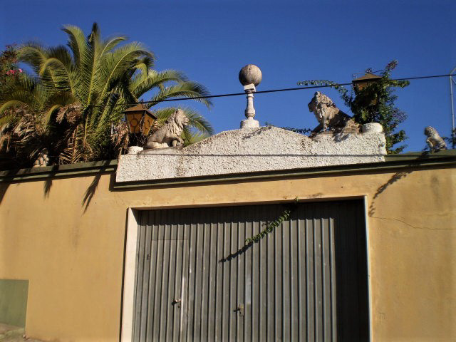 Lions on top of garage door.