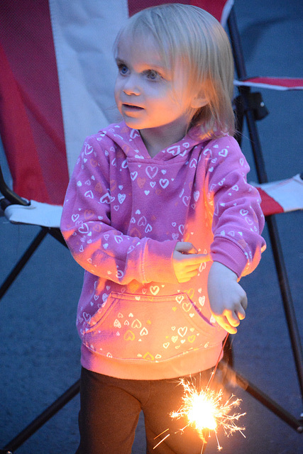 A tyke learns about sparklers