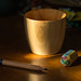 Bamboo cup, a pencil and an eraser