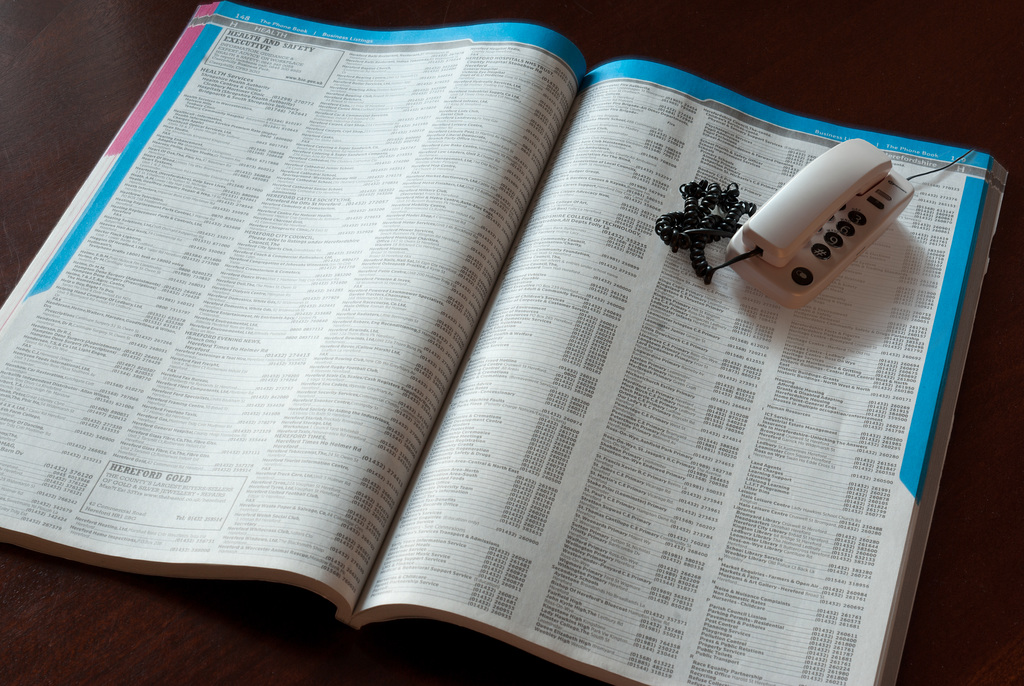 Telephone with telephone directory - photo montage