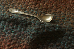 Knitted fabric with antique spoon