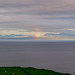 Regenbogen über einer Bucht in Schottland