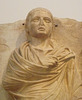 Detail of a Grave Stele of a Youth Wearing a Himation in the  National Archaeological Museum in Athens, May 2014