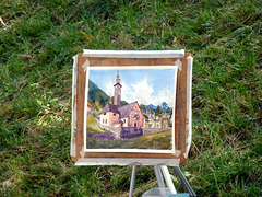 Un artista sta ritraendo la Chiesa della Natività di Maria Vergine (cfr. foto precedente)  -  Croveo (VB)