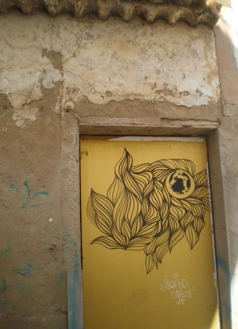 Painted on walled door.