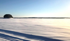 snowmobile crossing the lake