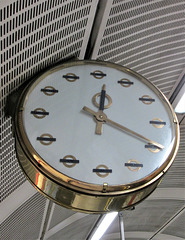 Vintage brass clock with London transport logos