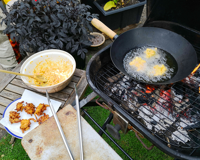 Onion bhajis frying