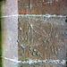 hazleton church, glos (12)daisy wheel graffiti in the porch; was it incised before the stone was cut to this shape?