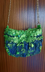 small felted handbag with a chain