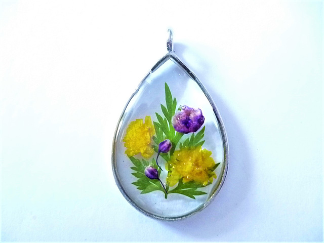 Teardrop shape with yellow and purple flowers