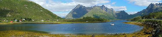 Small boat at Vestpolltjønna bay of Austnesfjorden + Lilandstinden and Geitgallien in background