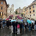 Rome 2026 – Tourists in the rain at the foot of the Spanish Steps