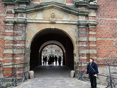 Entering the outer courtyard of Frederiksborg Castle. Guy above the doorway looks like he's been snorting some illegal substances.