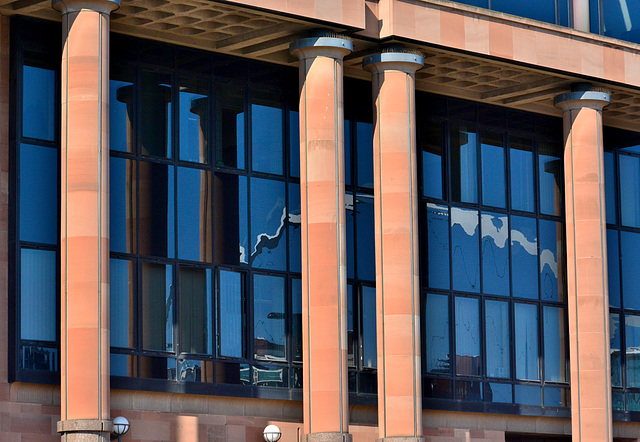 The Law Courts reflecting The Millenium Bridge