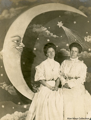 Women Posing with a Paper Moon