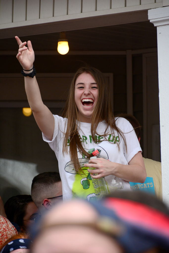 Greeting the photographer from across the crowd