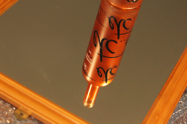 141/365 2025 bottle in mirror