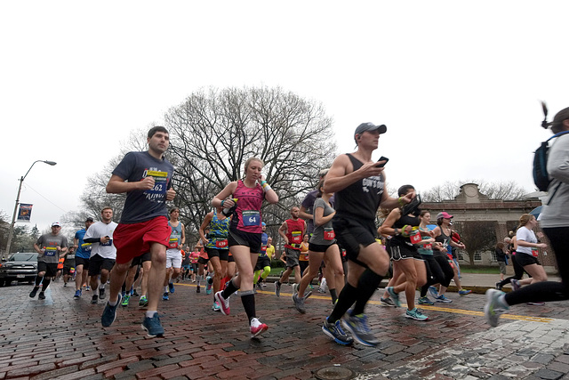 Running past the arch on College Green