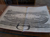 Ancient book in a display case.