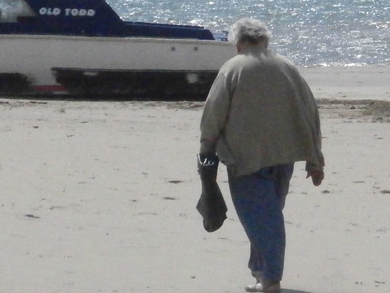 Lady carrying black bags