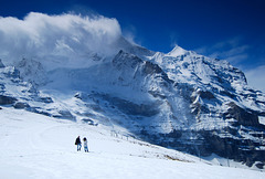 Young couple exploring Jungfau, near to Lauterbrunnen