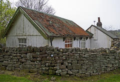 Bungalows at Padley Chapel, Grindleford; formerly quarry workers' huts.