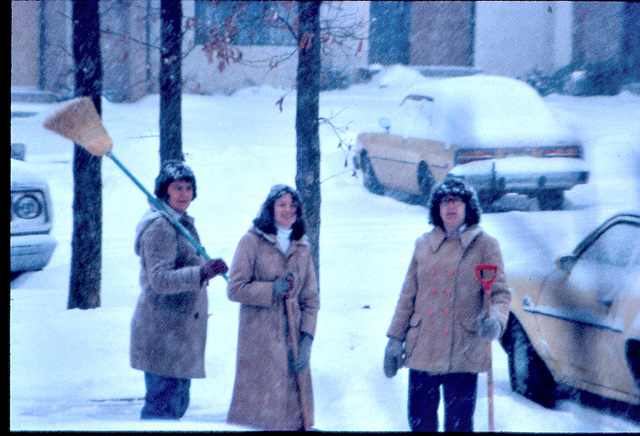 Women of the neighborhood take up arms to try and stay ahead of the snowfall as layabout man snaps sexy photos