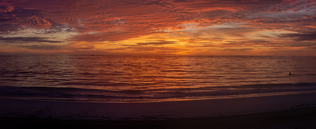 Swimmer at sunrise