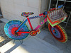 Urban knitting on bicycle.