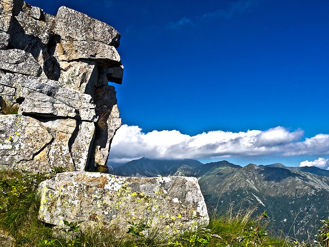 A stone face oversees the Cervo valley