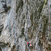 Climber on limestone cliff