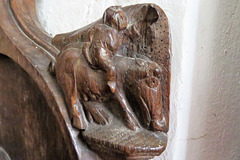 over church, cambs, man riding ?horse,  elbow on c15 stalls