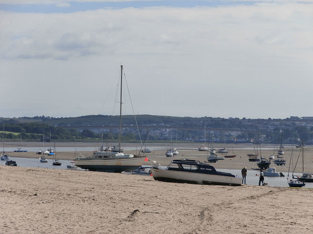Some boats are beached with the tide out
