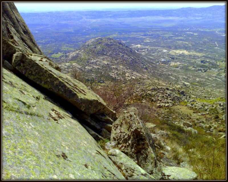 My occasional picnic spot. I would lie back on the smooth slab, after wedging my tuppaware of chorizo sandwich and tomatoes - and the water bottles - under the rock in front, and enjoy the view..