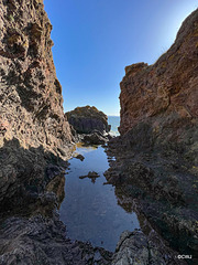 Rock pools at the base of the cliff path to McFarquhar's Cave